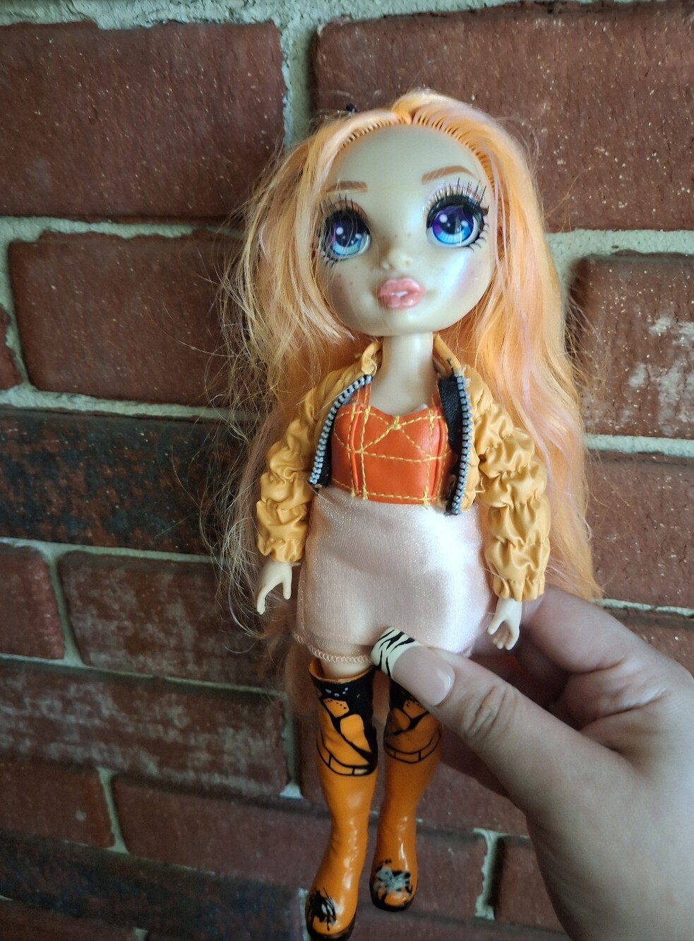 This is a Rainbow High Series 1 Poppy Rowan fashion doll